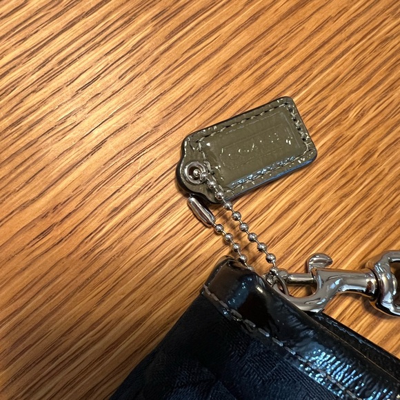 Black Coach clutch with zipper and one inside pocket. - Picture 3 of 9
